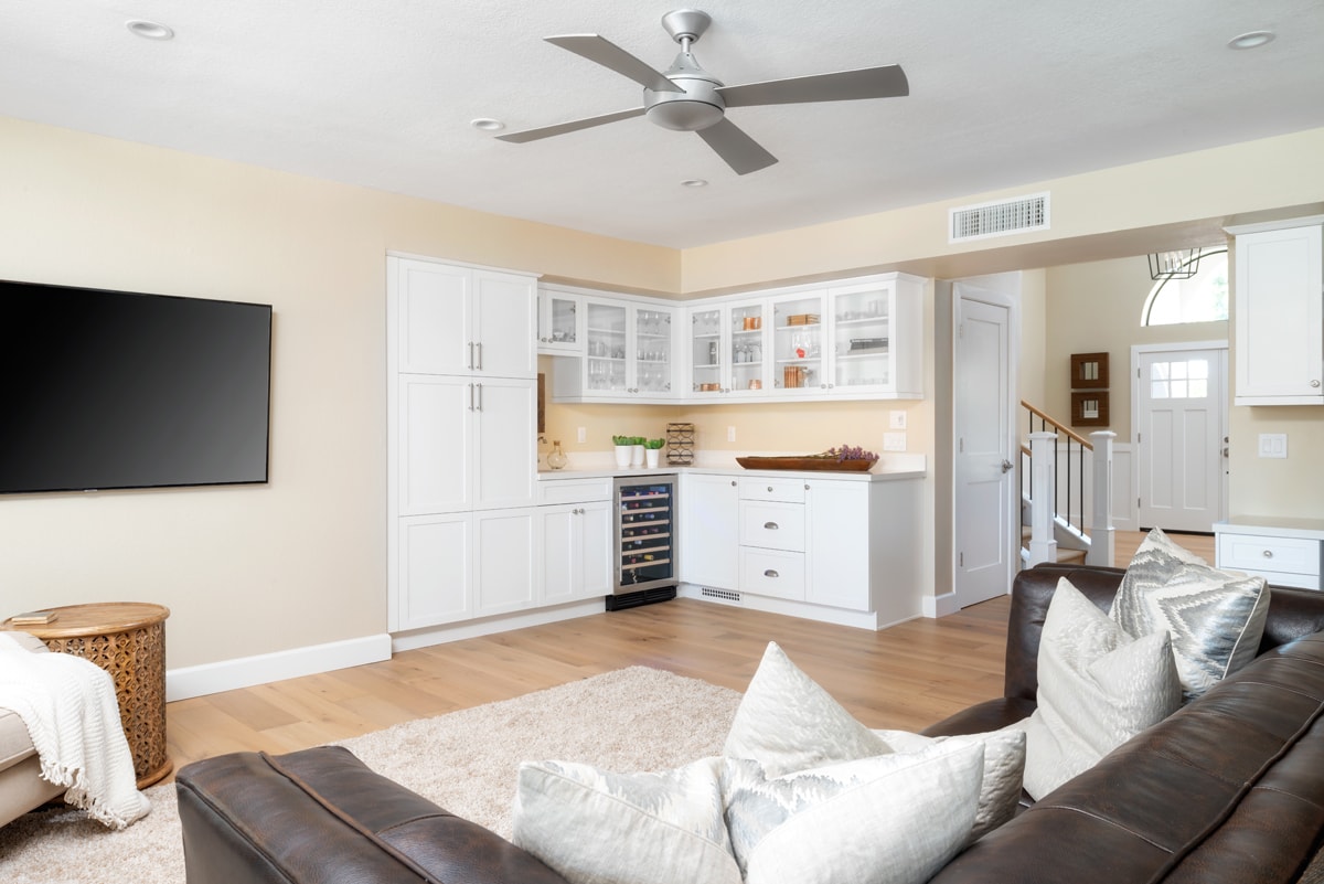 White corner bar in a living room.