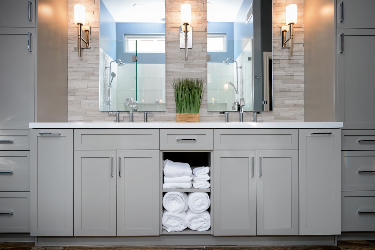 Light grey double vanity with shaker-style doors.