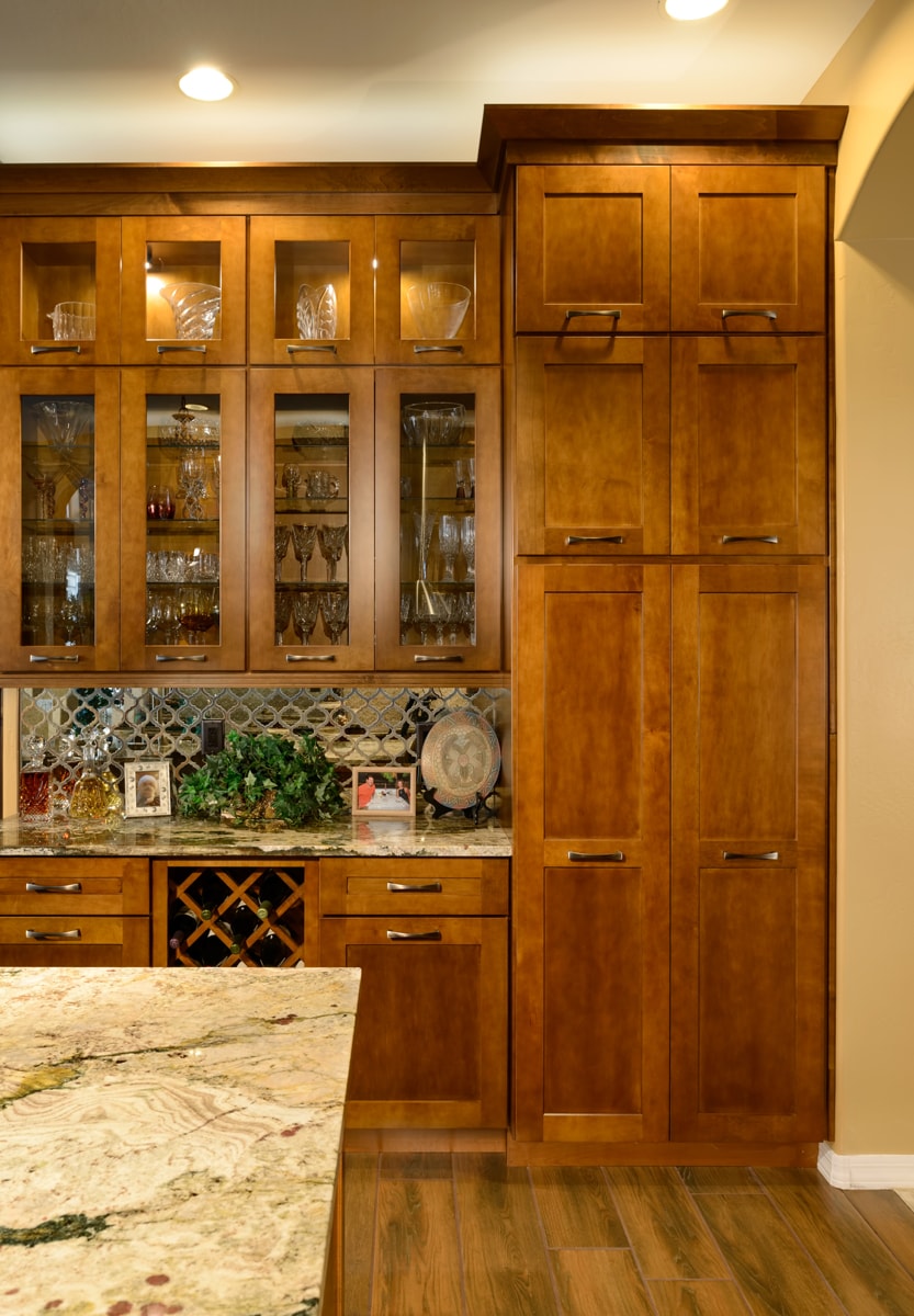 Warm wood floor to ceiling pantry.