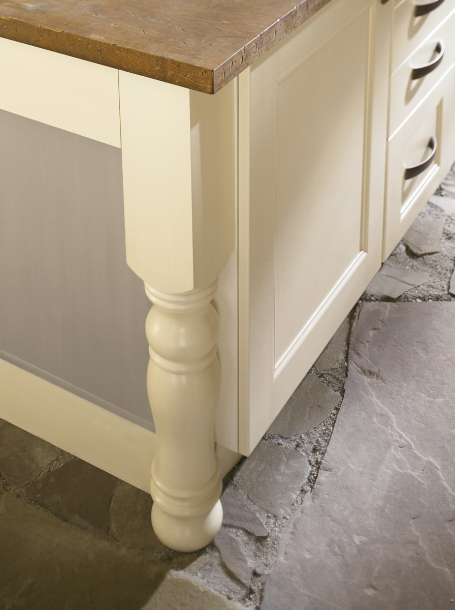 Close-up of a cream colored kitchen island leg.